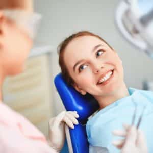 Doctor and Patient discussing different types of Dental Services including Dental Extractions
